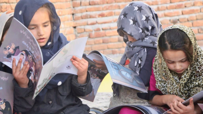 Afghan children reading Idries Shah Children's books
