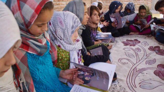 Afghan children reading Idries Shah Children's books